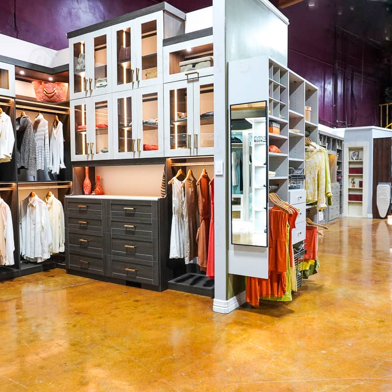 Showroom view of a two toned closet and led lighting.