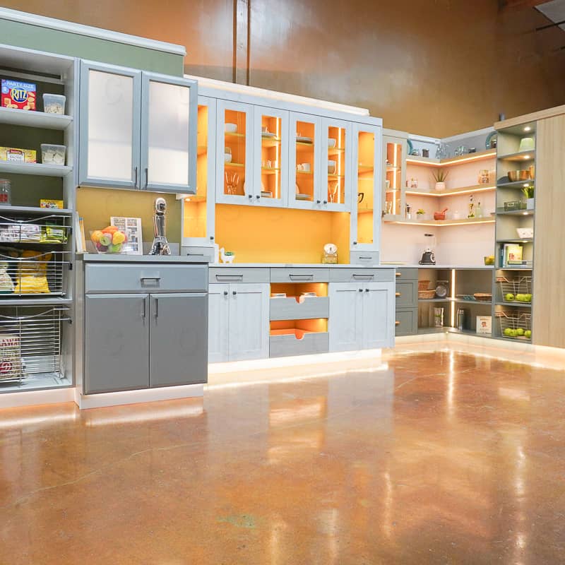 Showroom view of the pantry sections of our showroom, showing silver pantry, butler pantry and our two-toned pantry.