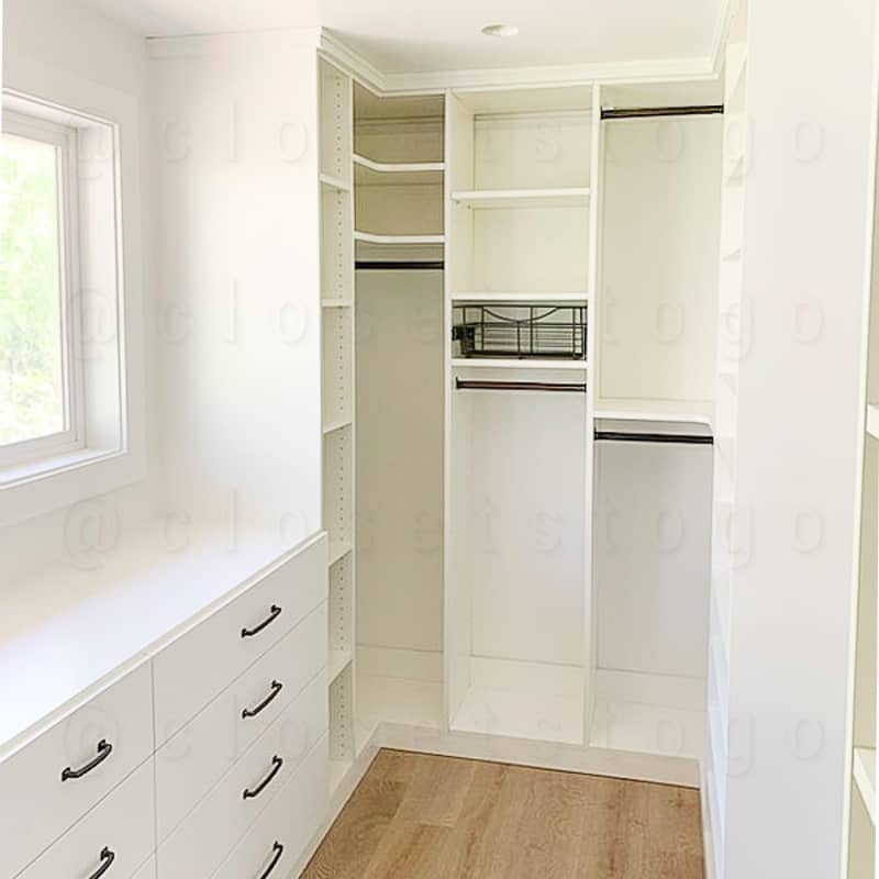 A bright walk in closet system with a variety of storage styles ensuring a place for everything.