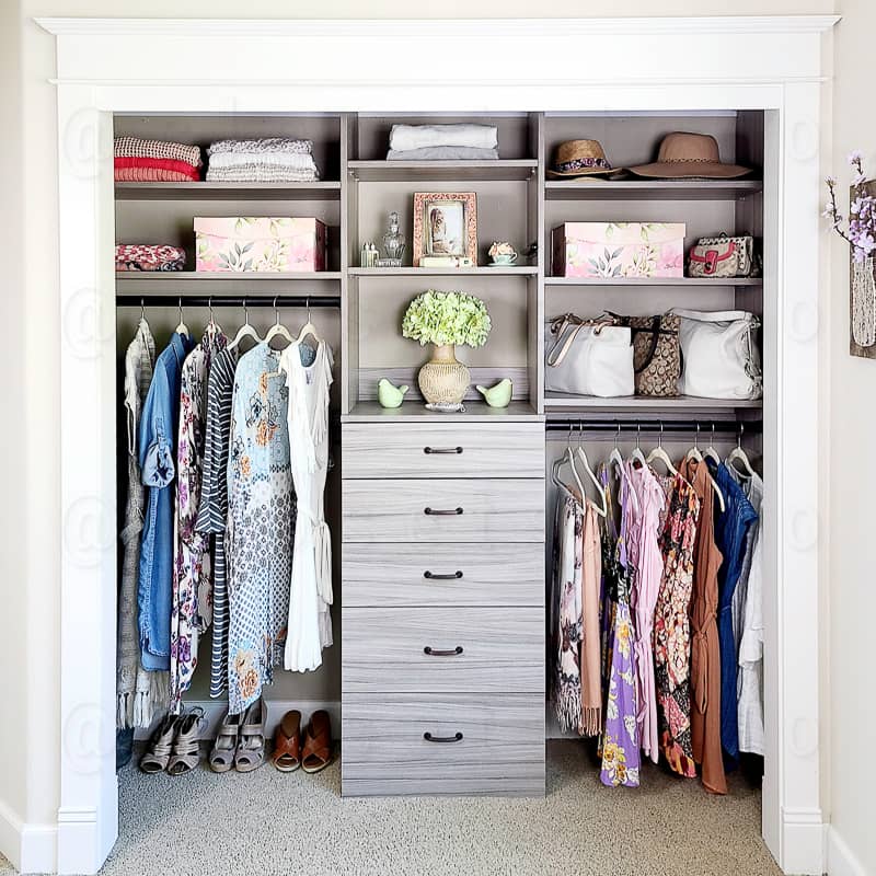Custom reach in closet, adjustable shelves, dresser built into the closet system.