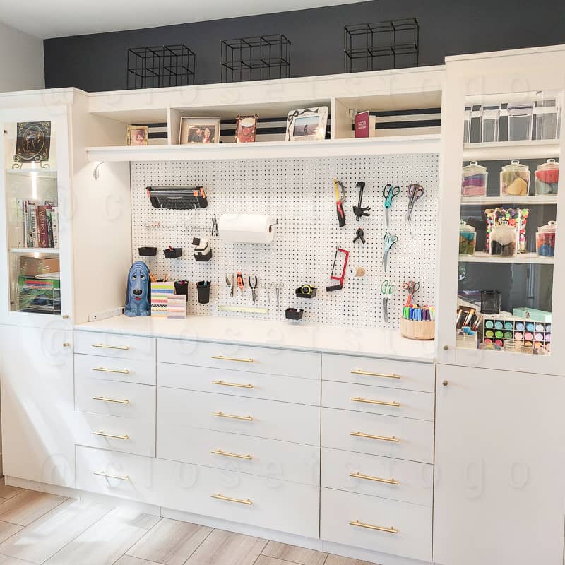 White craft closet with led lighting.