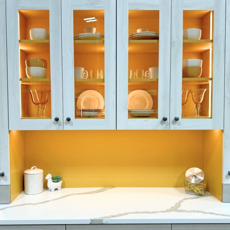 Same pantry but from a focus on baskets and glass pantry door