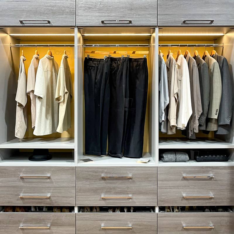 Two toned yellow and grey butler pantry with glass doors and LED lighting