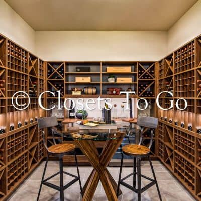 Walnut wine walk in closet with abundant room for bottles