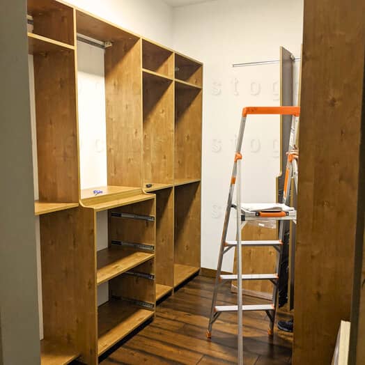 The closet install process with new storage medium hang and shelves