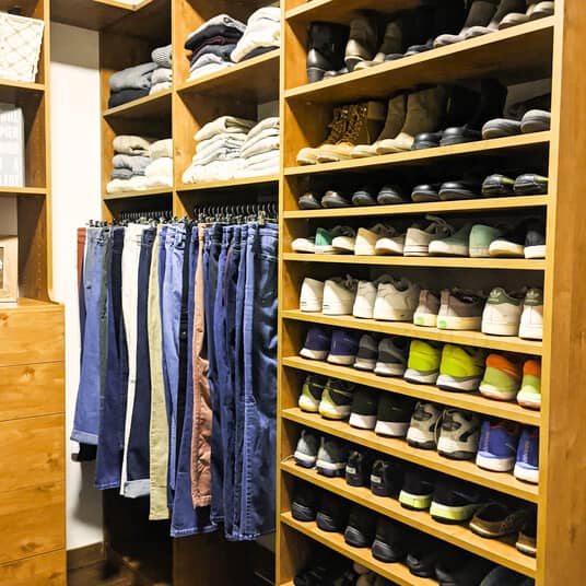 A side view of the shoe storage with rows of shoes