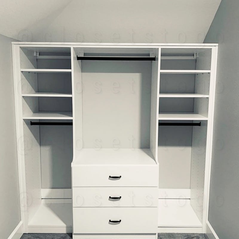 White closet with drawers and shelves and rods.