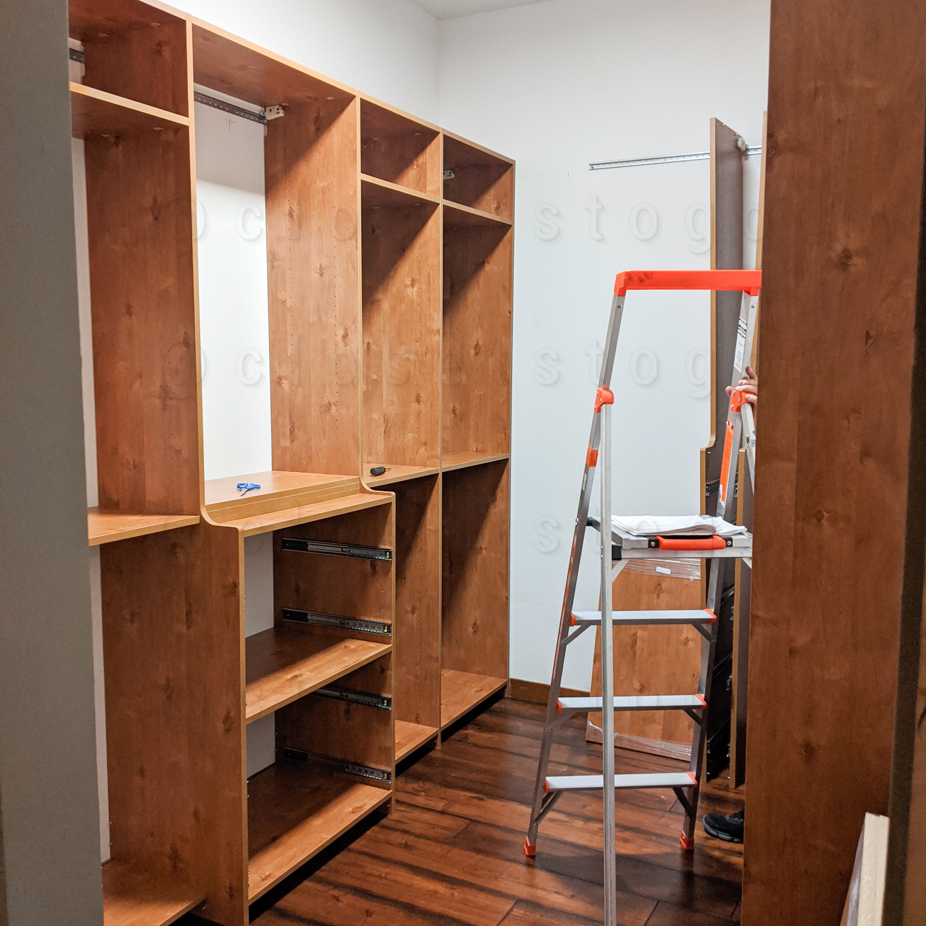 The closet install process with new storage medium hang and shelves