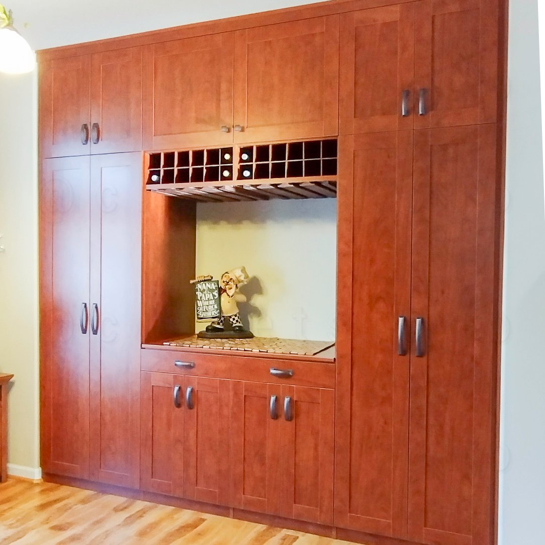 Medium warm brown butler with closed doors and wine bottle section