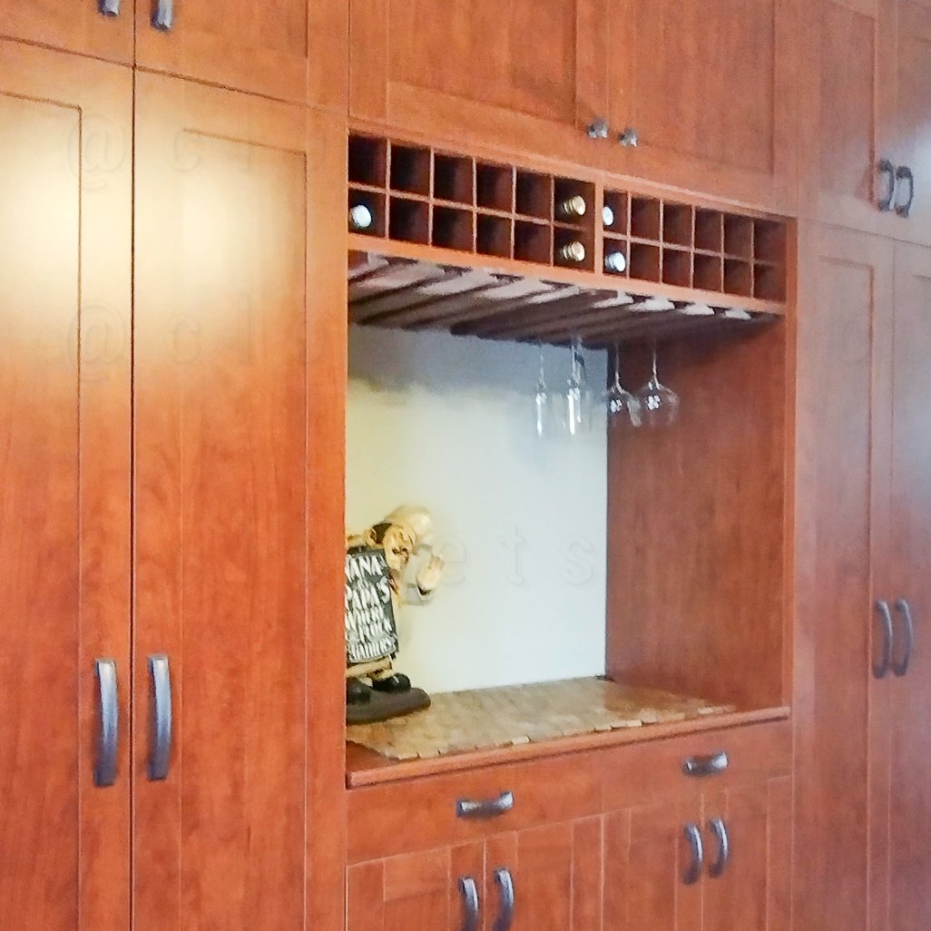 The pantry's side view with center focus of the wine bottle section