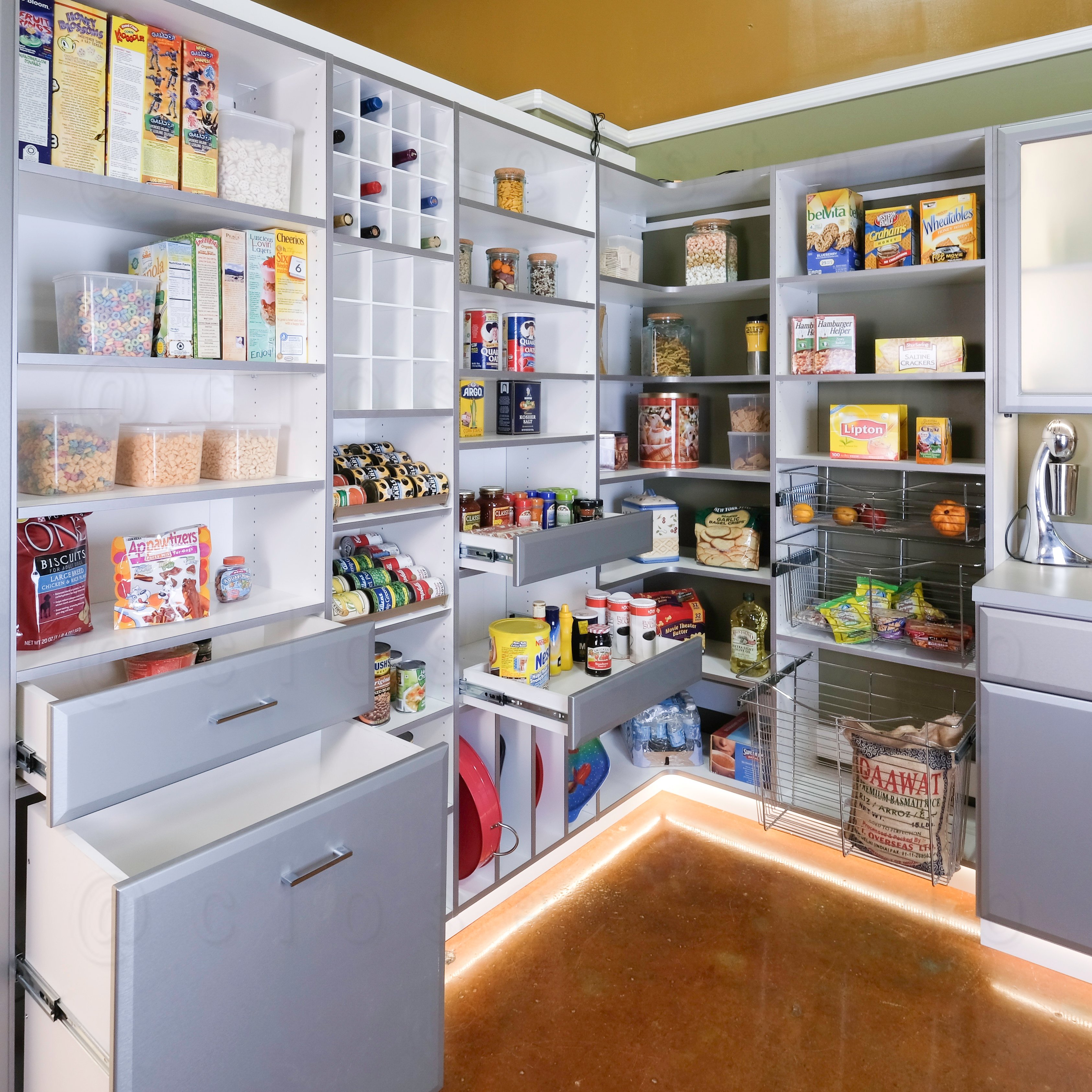 A silver walk-in kitchen pantry